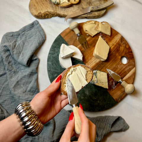 A selection of plant-based cheeses - Camembert, blue and smoked cheddar cheese