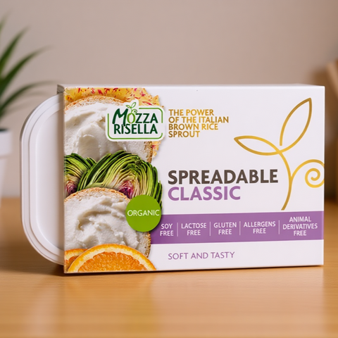 Mozza Risella Spreadable Classic packaging on a wooden surface with a blurred background